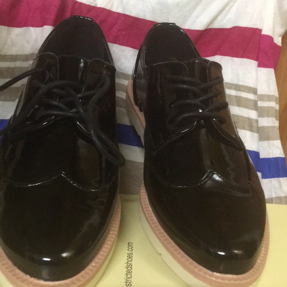 Black wing tip shoes